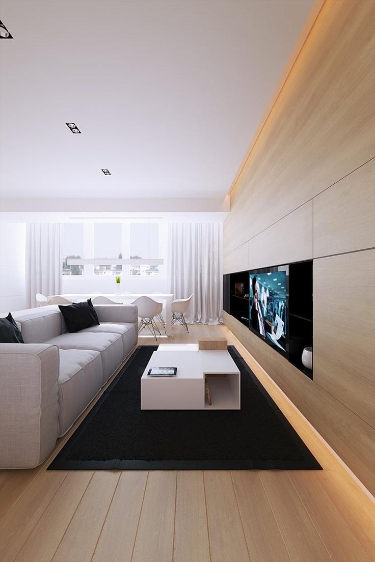 Sala de TV com parede de madeira clara